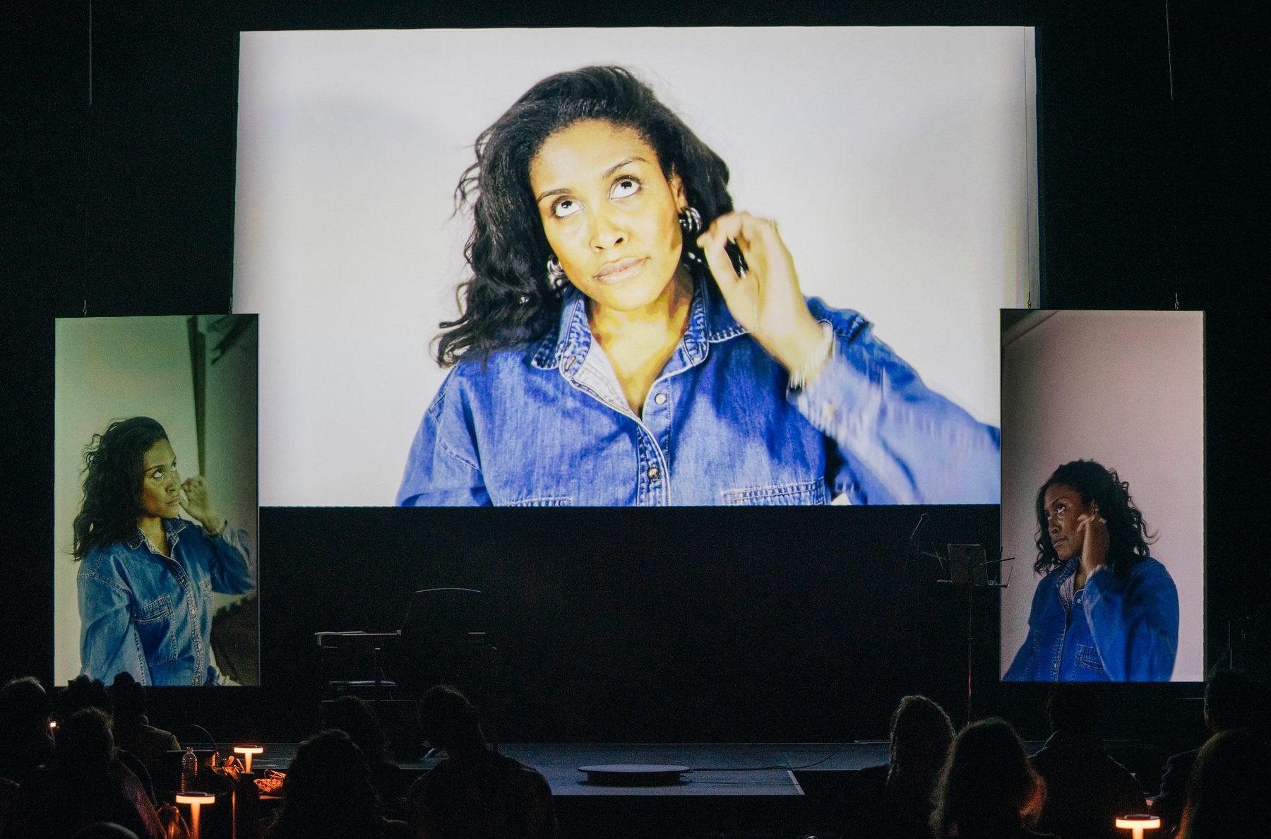 Mandy Harris Williams performing Critique Cabaret with triple screens at Performance Space New York